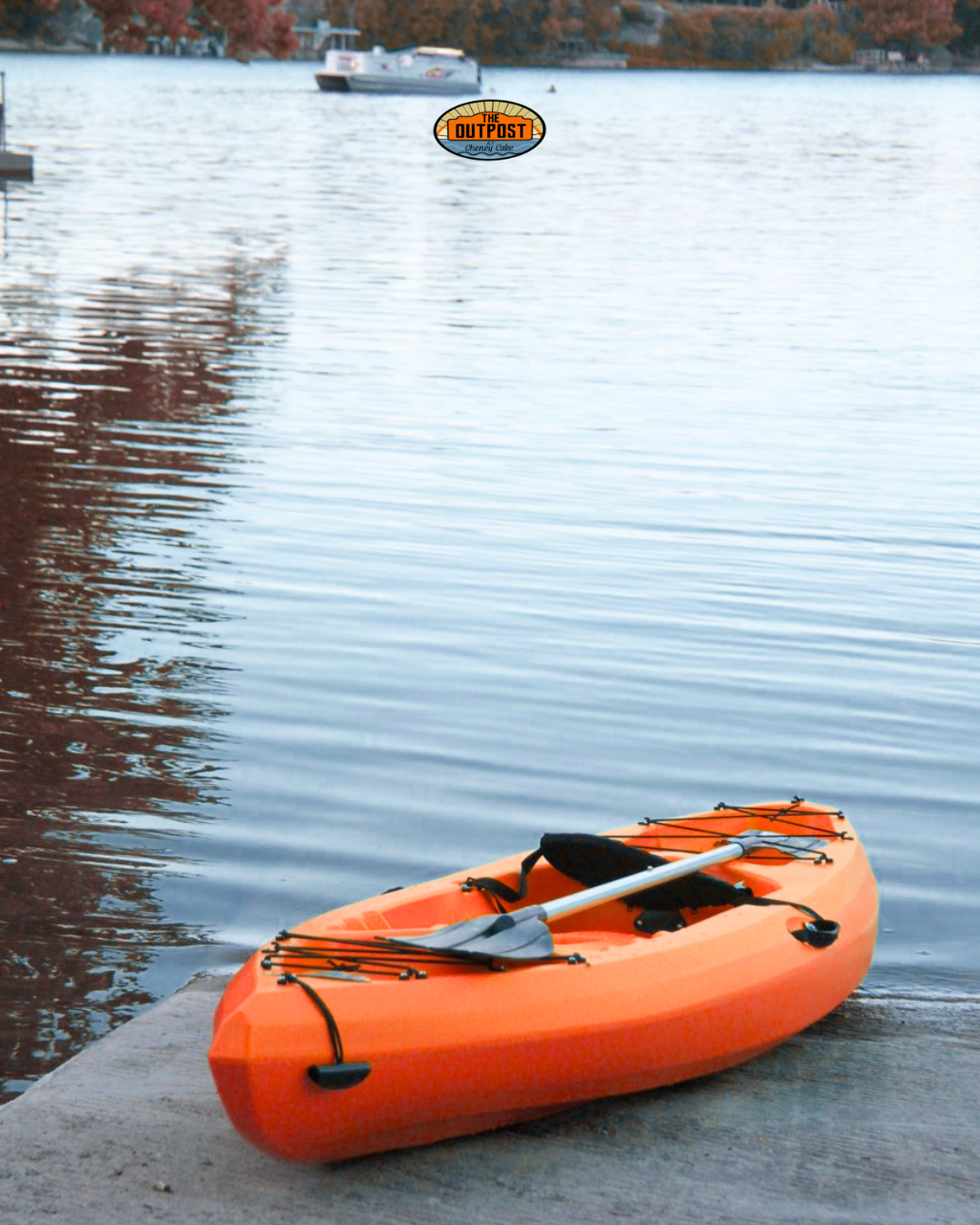 Single orange kayak on the dock at Cheney Lake, ready to paddle
