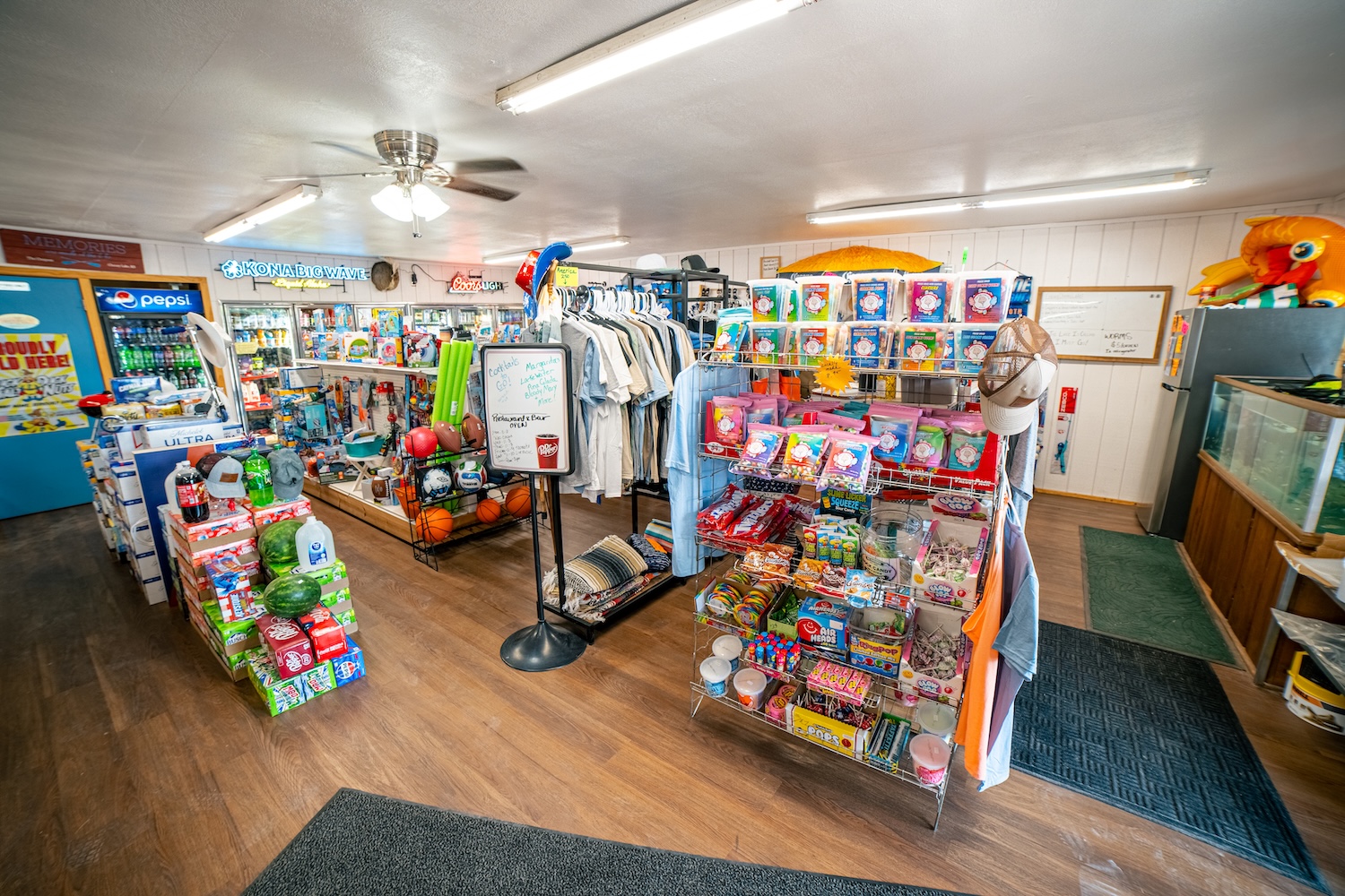 Inside The Outpost convenience store — snacks, drinks, apparel and lake gear